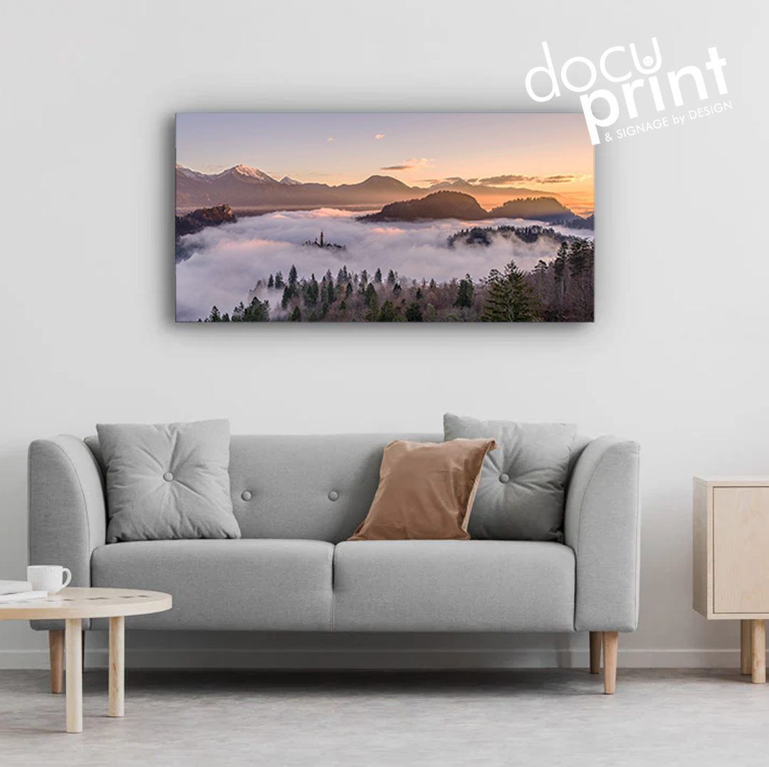 Canvas print featuring a panoramic landscape painting, custom designed and printed by Docuprint, displayed on a wall above a gray sofa in Fremantle, Perth, Australia