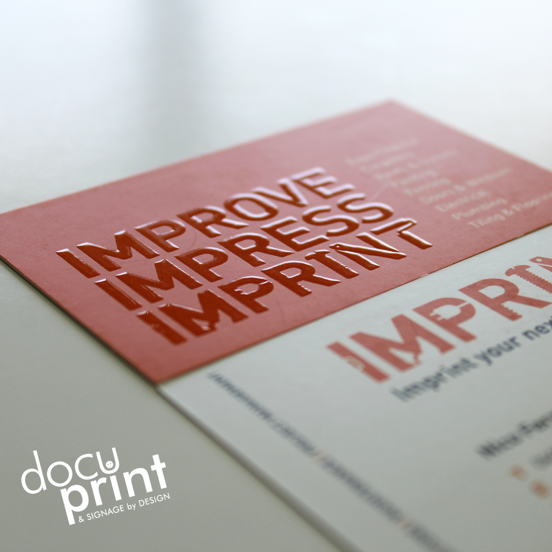 Raised spot UV business card with raised text, red and white in colour, custom designed and printed by Docuprint in Fremantle, Perth, Australia
