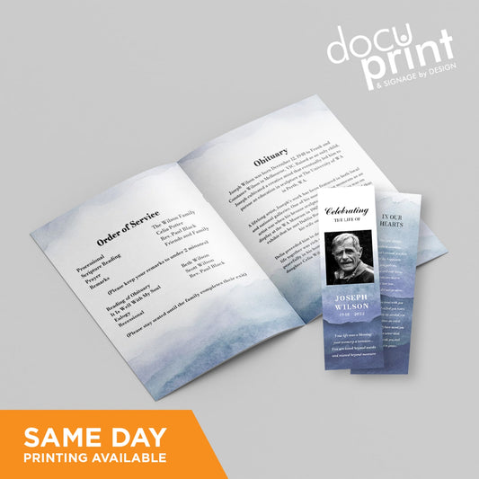 A funeral collection, including service booklets and memory bookmarks, with text and artwork design, laid out on a flat surface , custom designed and printed by Docuprint in Fremantle, Perth, Australia