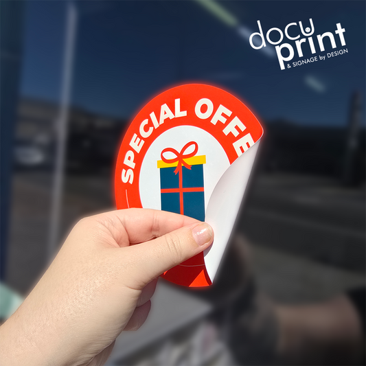 Static cling film featuring a present and special offer text, custom designed and printed by Docuprint in Fremantle, Perth, Australia