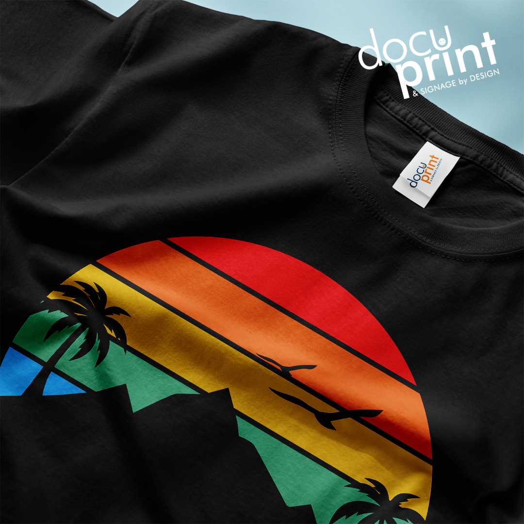 Black t-shirt with a colourful round image in the center of mountains, trees and birds, custom designed and printed by Docuprint in Fremantle, Perth, Australia