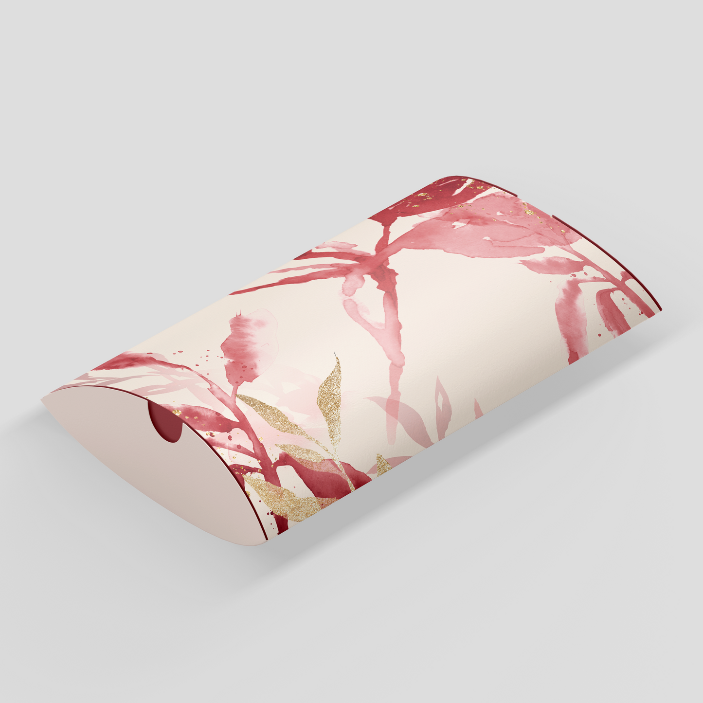 pillow box product or jewellery packaging with beige background, pink leaves and gold foiling, custom designed and printed by Docuprint in Fremantle, Perth, Australia