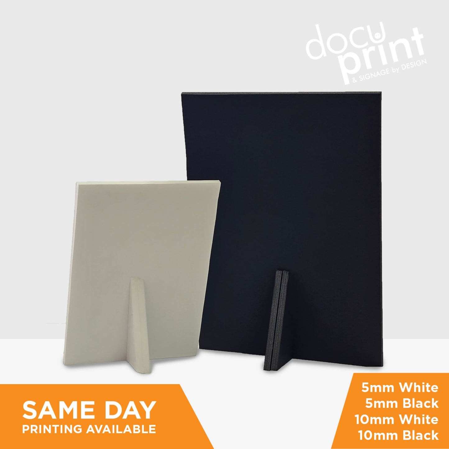 An image showing the back of a foamboard sign, where there are easy stands so they can sit on countertops, A5 Saddle stitched booklets featuring a beauty clinic, custom designed and printed by Docuprint in Fremantle, Perth, Australia. Sitting on a white surface, with green plants next to it. 
