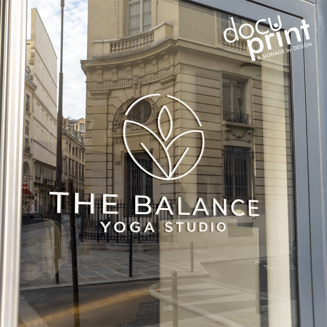 Kiss cut lettering of a yoga studio logo on the shopfront door, custom designed and printed by Docuprint in Fremantle, Perth, Australia