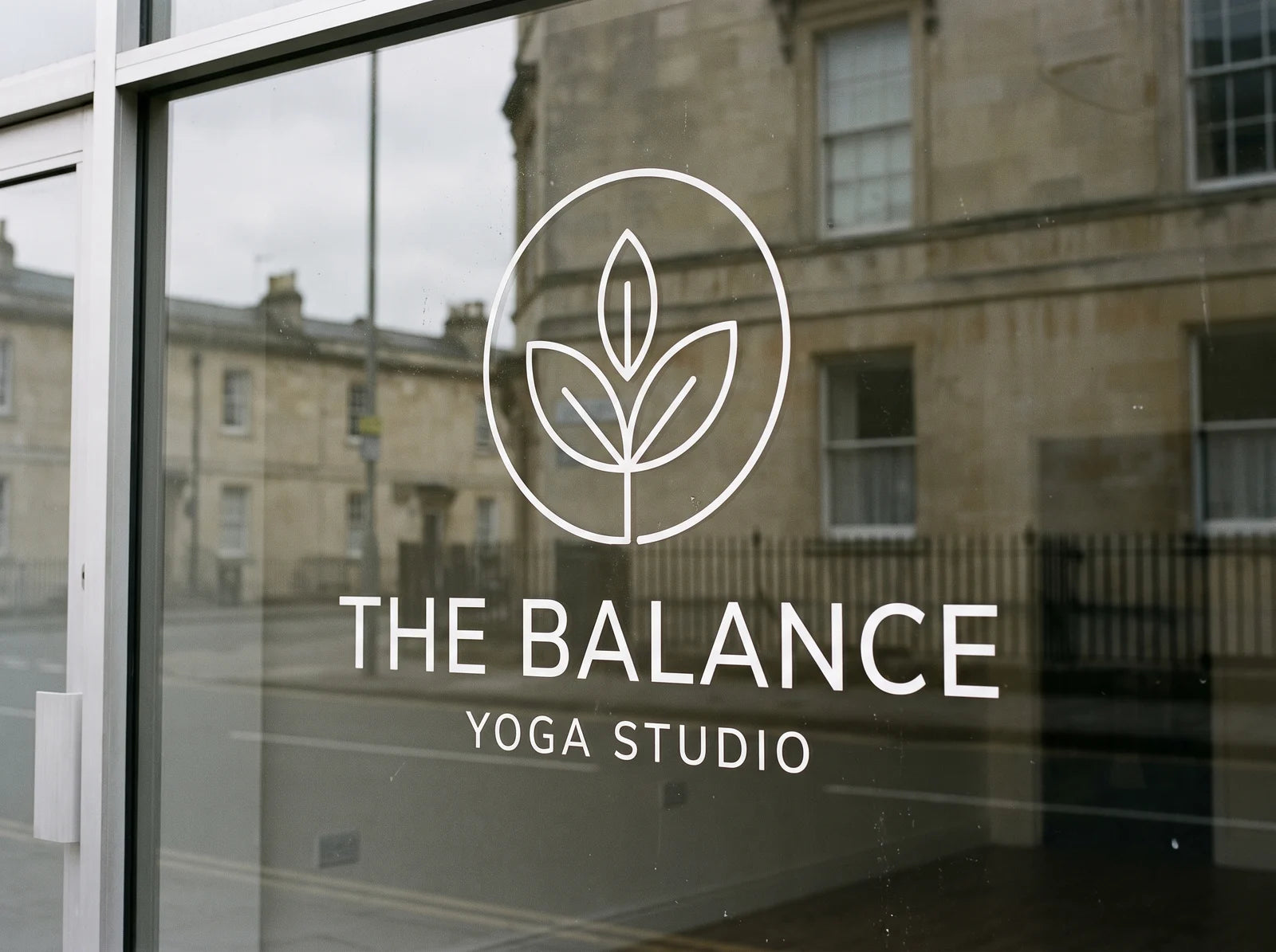 Cut vinyl logo and lettering applied to a shopfront window